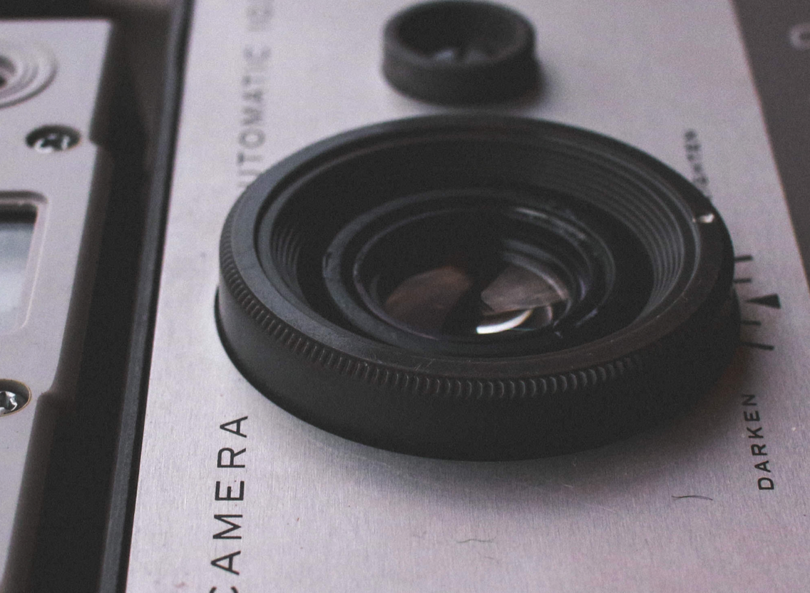The front of a camera with lens facing up